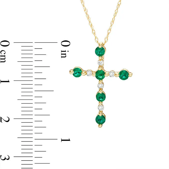 Goldia Necklaces LabCreated Emerald and Diamond Accent Cross Pendant in 10K Yellow Gold Goldia Necklaces LabCreated Emerald and Diamond Accent Cross Pendant in 10K Yellow Gold